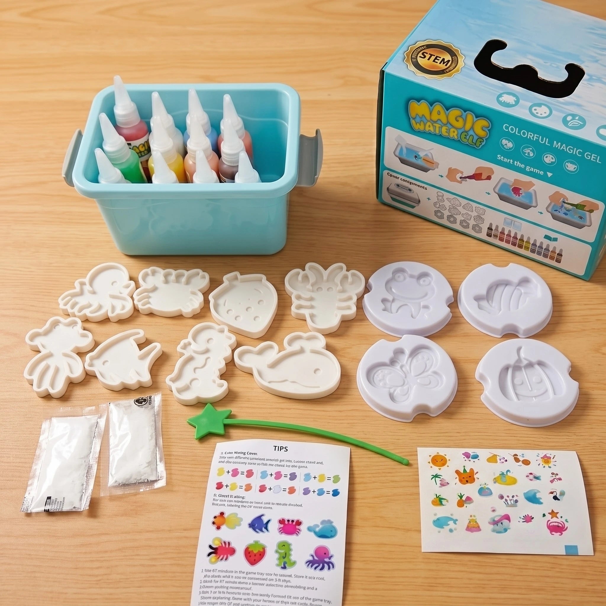 Contenido completo del Kit Aqua Fairy 3D: caja Magic Water Elf, moldes de animales, botellas de colores, sobres de polvo mágico y guía de instrucciones.