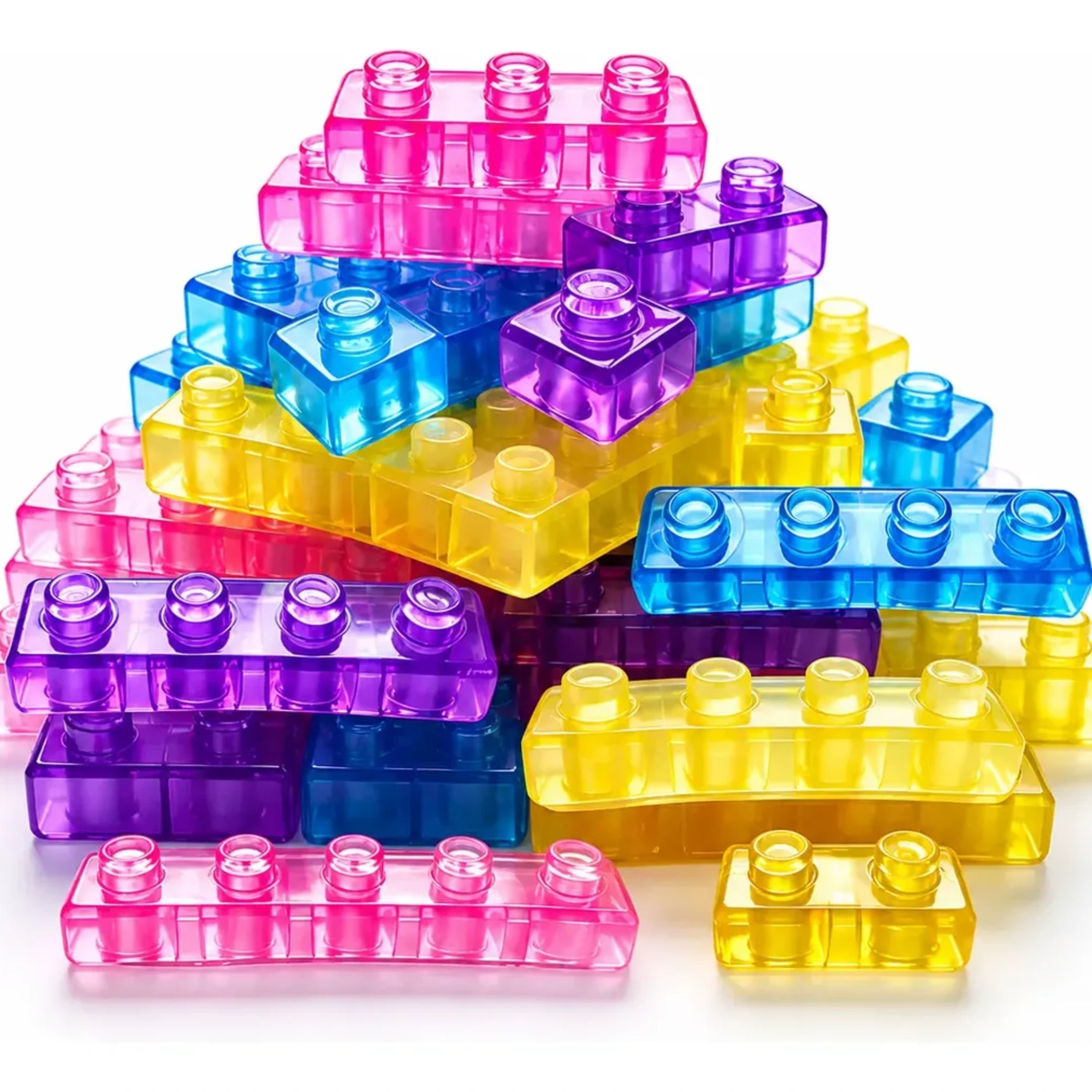 Pila de piezas Gummy Blocks translúcidas en distintos colores y tamaños